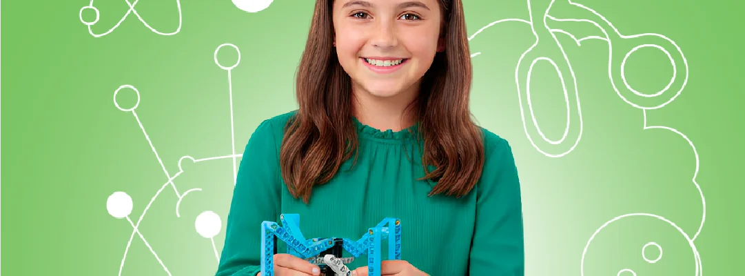 Niña aprendiendo robótica educativa con kit tecnológico en taller STEM para niños